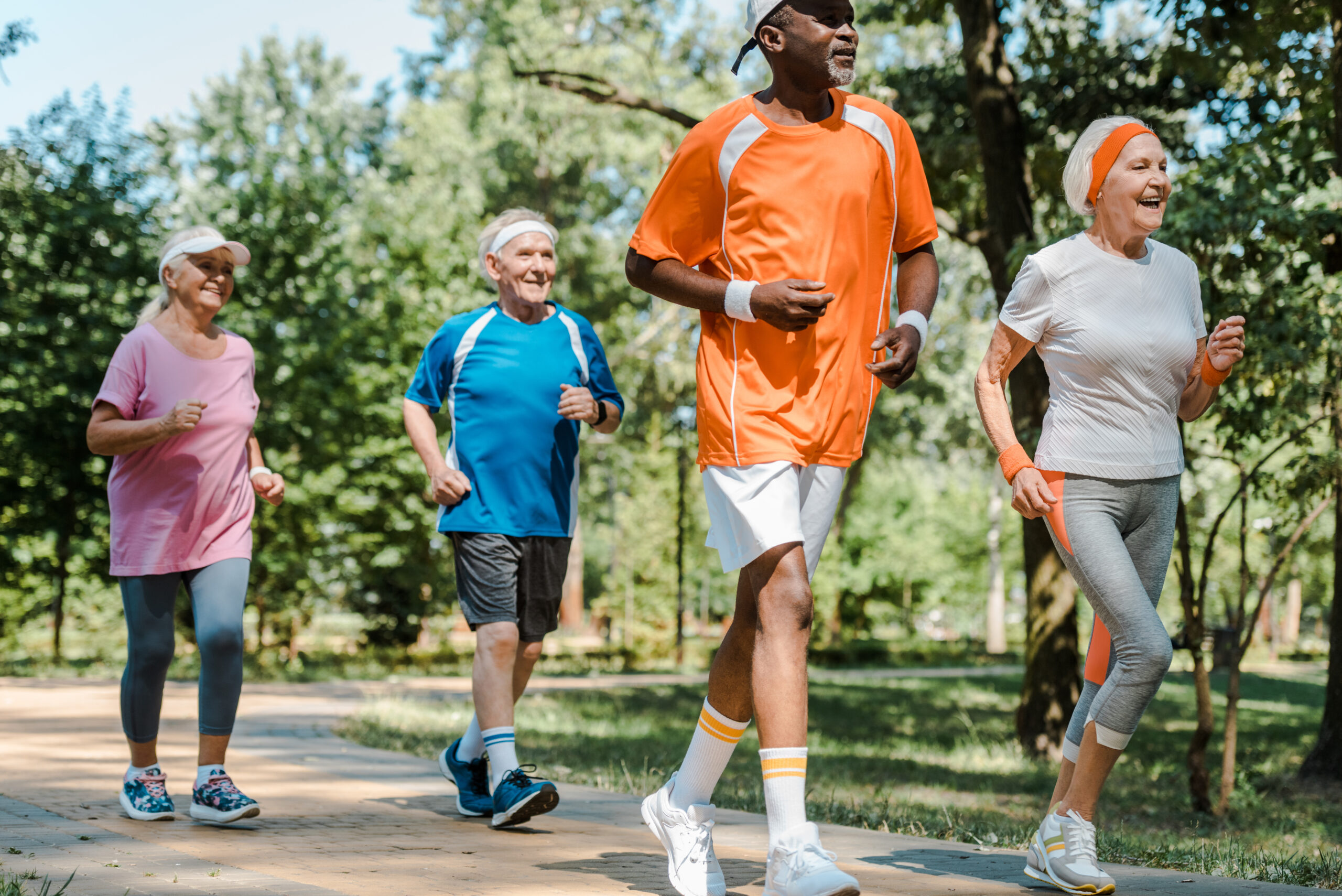 Sportive seniors in active clothes enjoying a jog